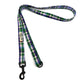 Plaid dog leash with a clip on a white background