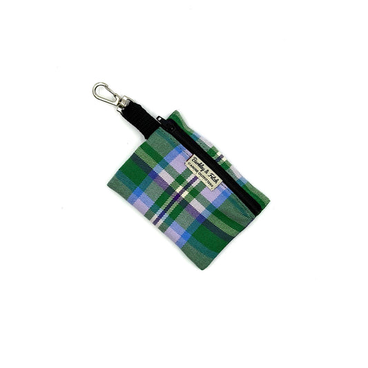 Green plaid pouch with black zipper and clip on a white background