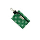 Green polka dot pouch with a keychain clip on a white background