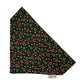 Star-patterned fabric with red, green, and gold stars on a black background handmade by barkley and fetch uk