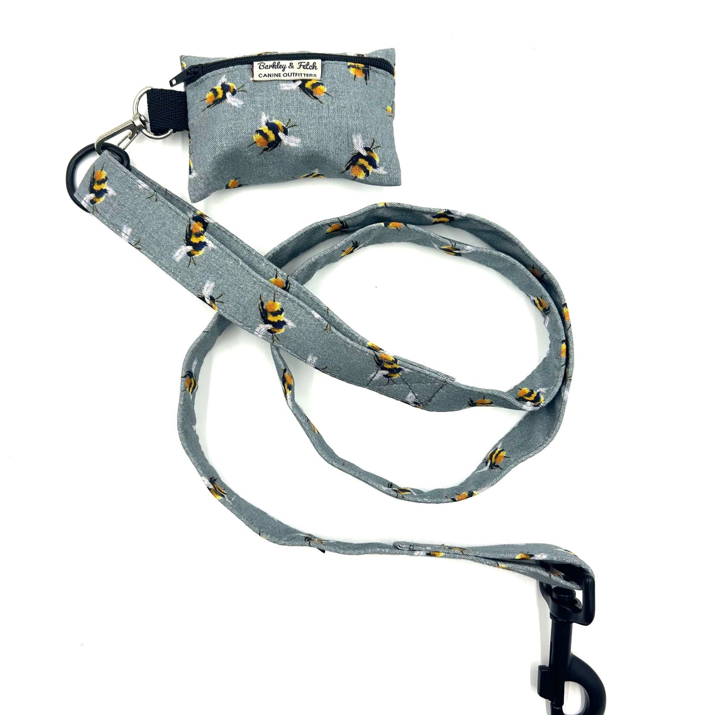 Gray dog leash with bee pattern and matching pouch on a white background