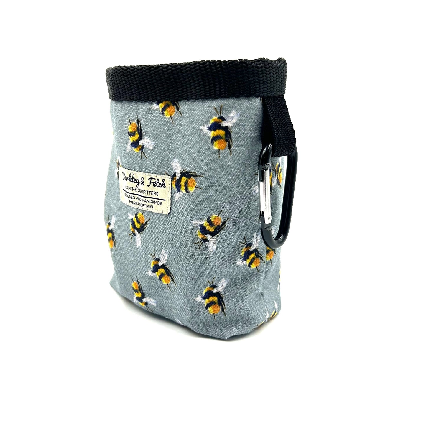 Fabric pouch with bee pattern and carabiner on a white background