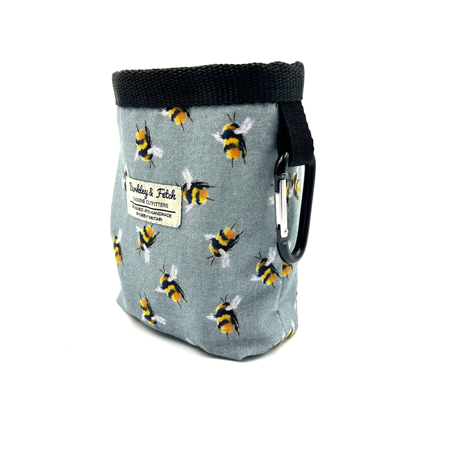 Fabric pouch with bee pattern and carabiner on a white background