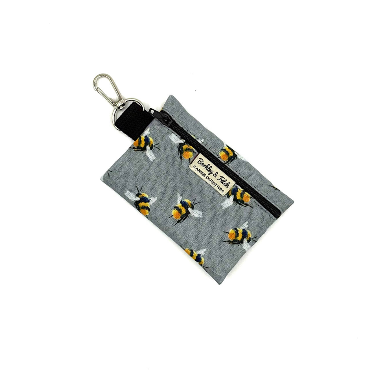 Keychain pouch with bee pattern on a gray background