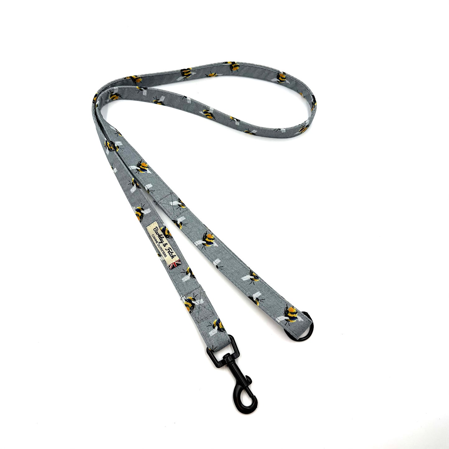 Dog leash with bee print pattern on a white background. Handmade in the uk by Barkley and Fetch
