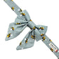 Bow tie with bee pattern on a light blue background handmade in uk by barkley and fetch