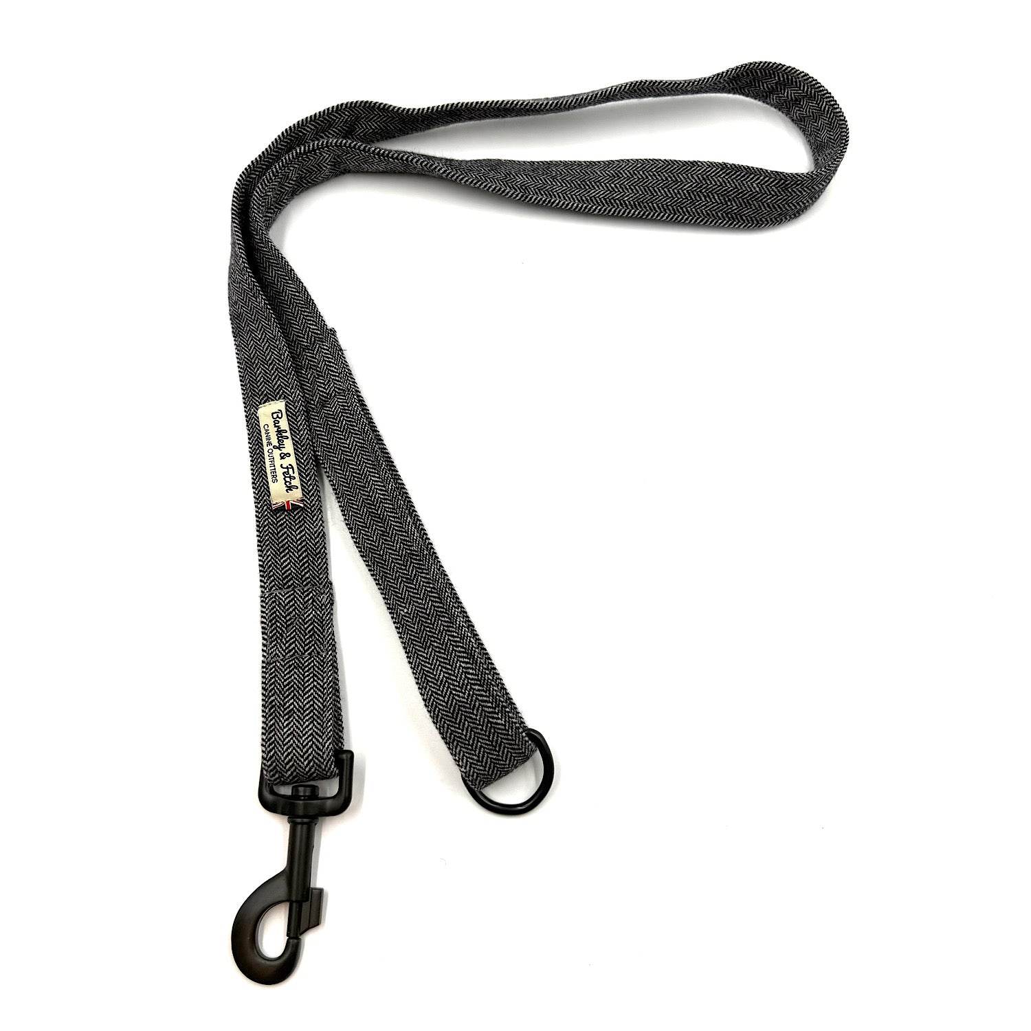 Black dog leash with a clip on a white background
