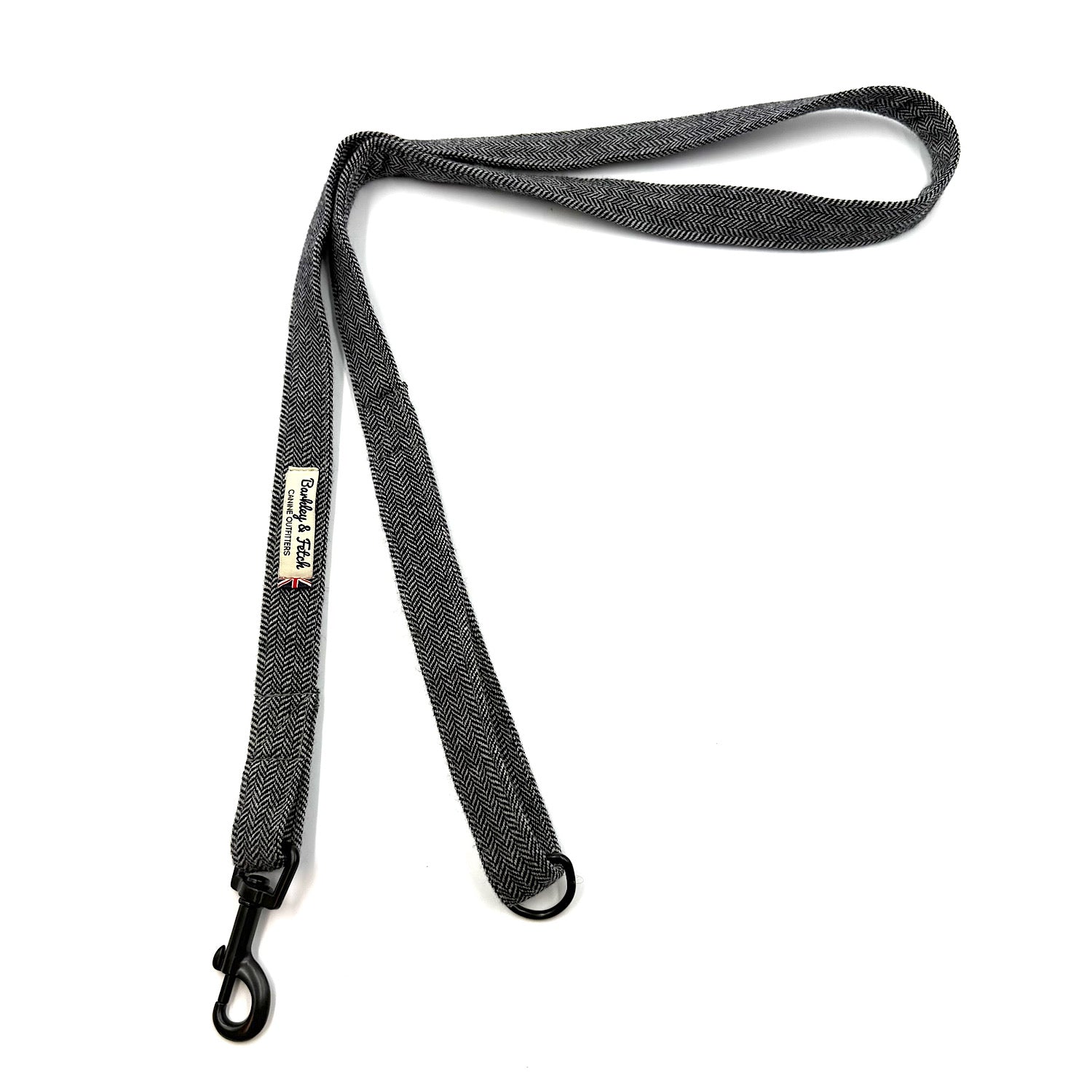 Black dog leash with a clip on a white background