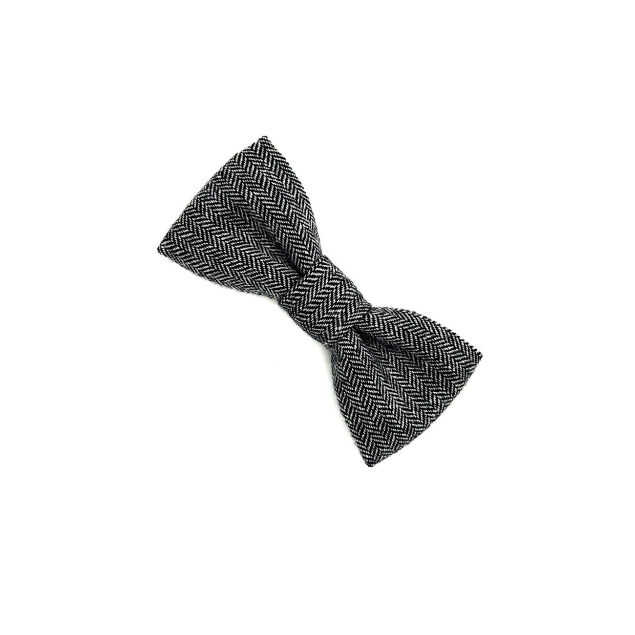 Black and white herringbone patterned bow tie on a white background