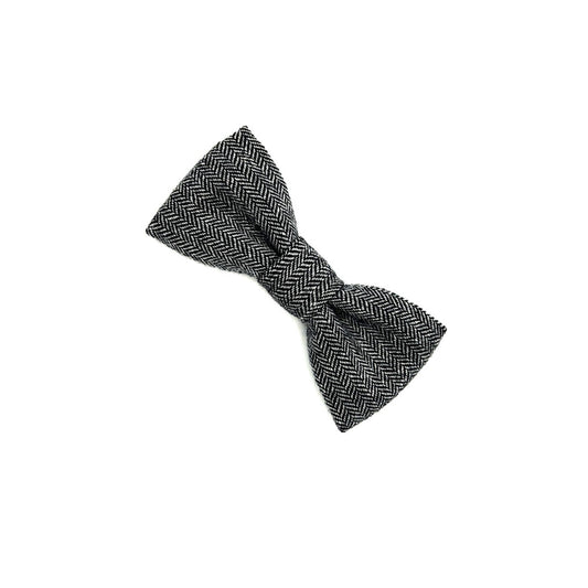Black and white herringbone patterned bow tie on a white background
