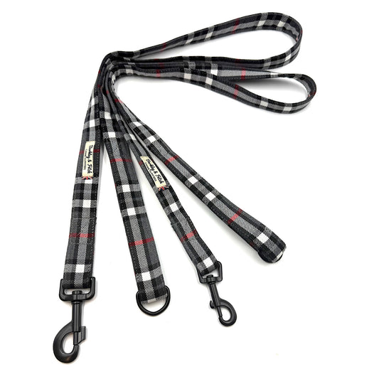 Plaid patterned dog leash on a white background