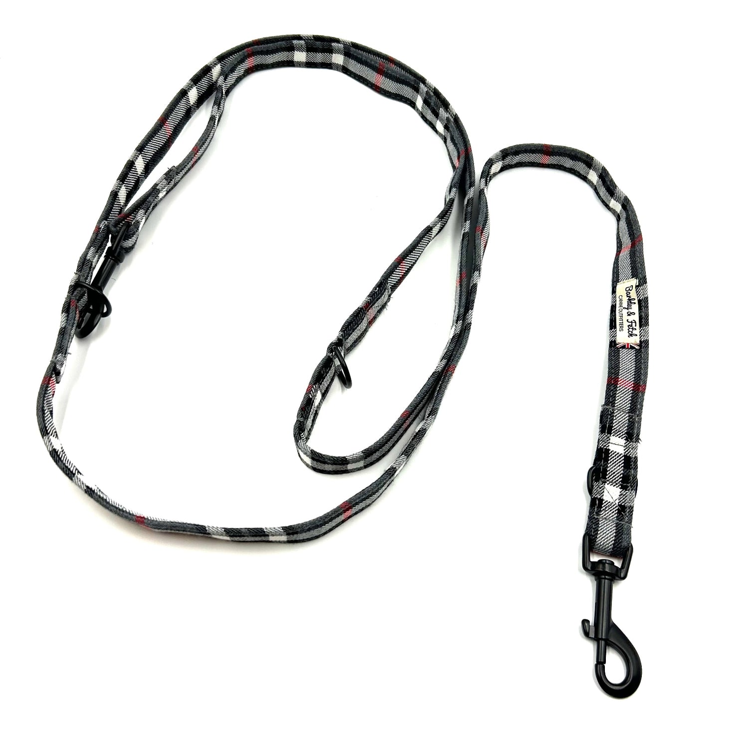 Plaid patterned dog leash on a white background