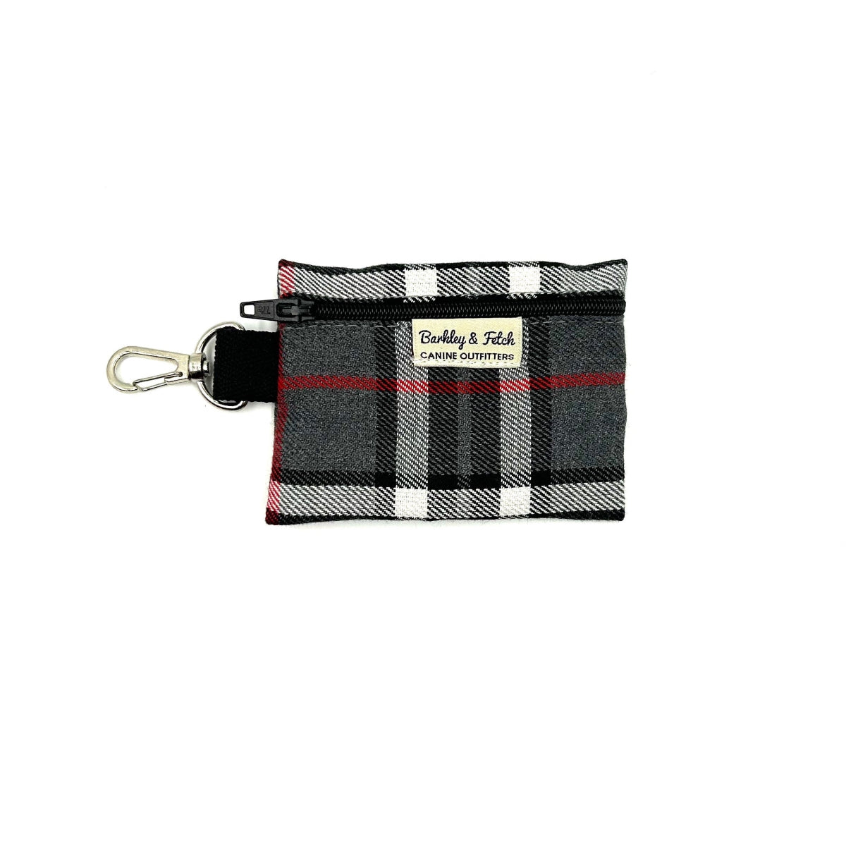 A gray and white tartan pattern poo bag holder with a keyring attachment, lying flat against a plain background.