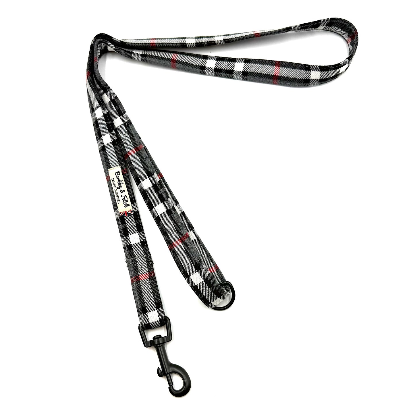 Plaid patterned dog leash on a white background