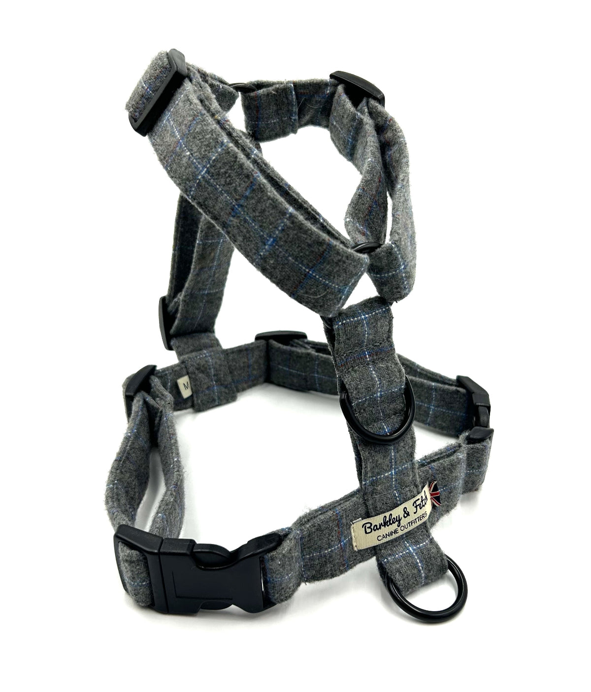 Gray checkered dog harness with a visible brand label on a white background handmade in the UK by Barkley and Fetch