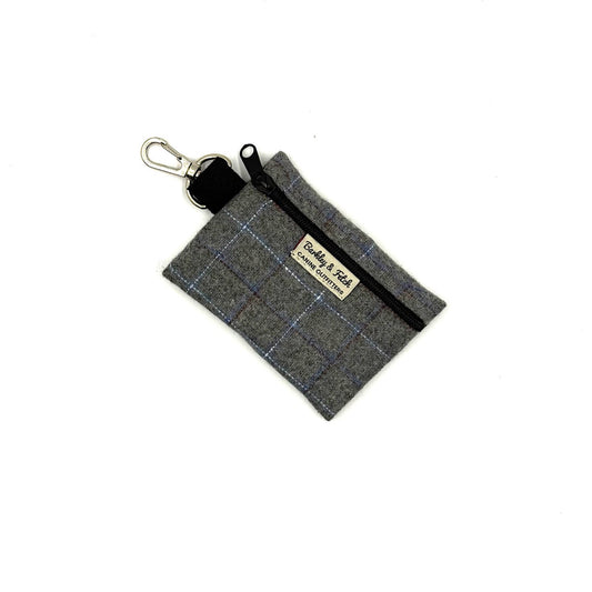 Gray plaid fabric pouch with a keychain clip on a white background