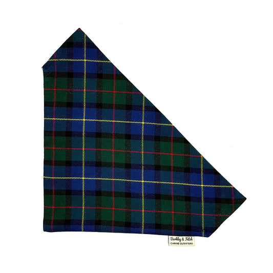 Plaid fabric with blue, green, and red pattern on a white background