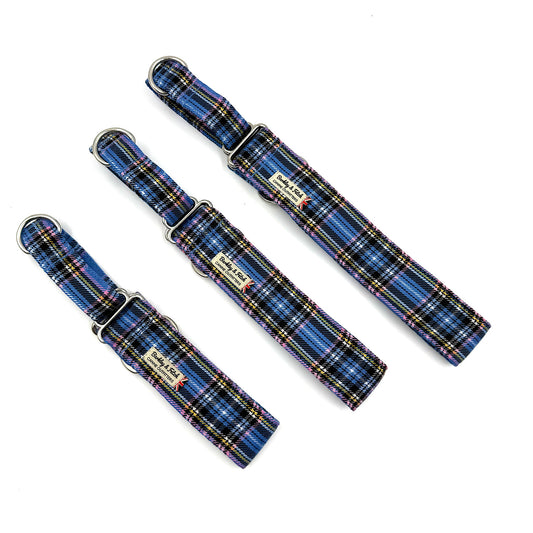 Three blue plaid dog collars on a white background