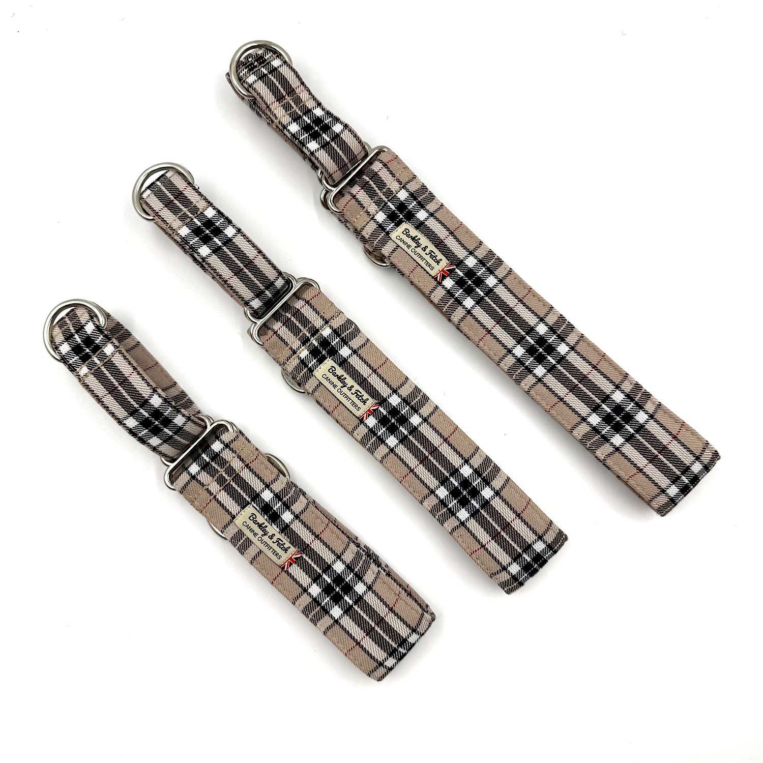 Three plaid dog collars on a white background