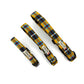 Three yellow tartan dog collars with visible branding on a white background