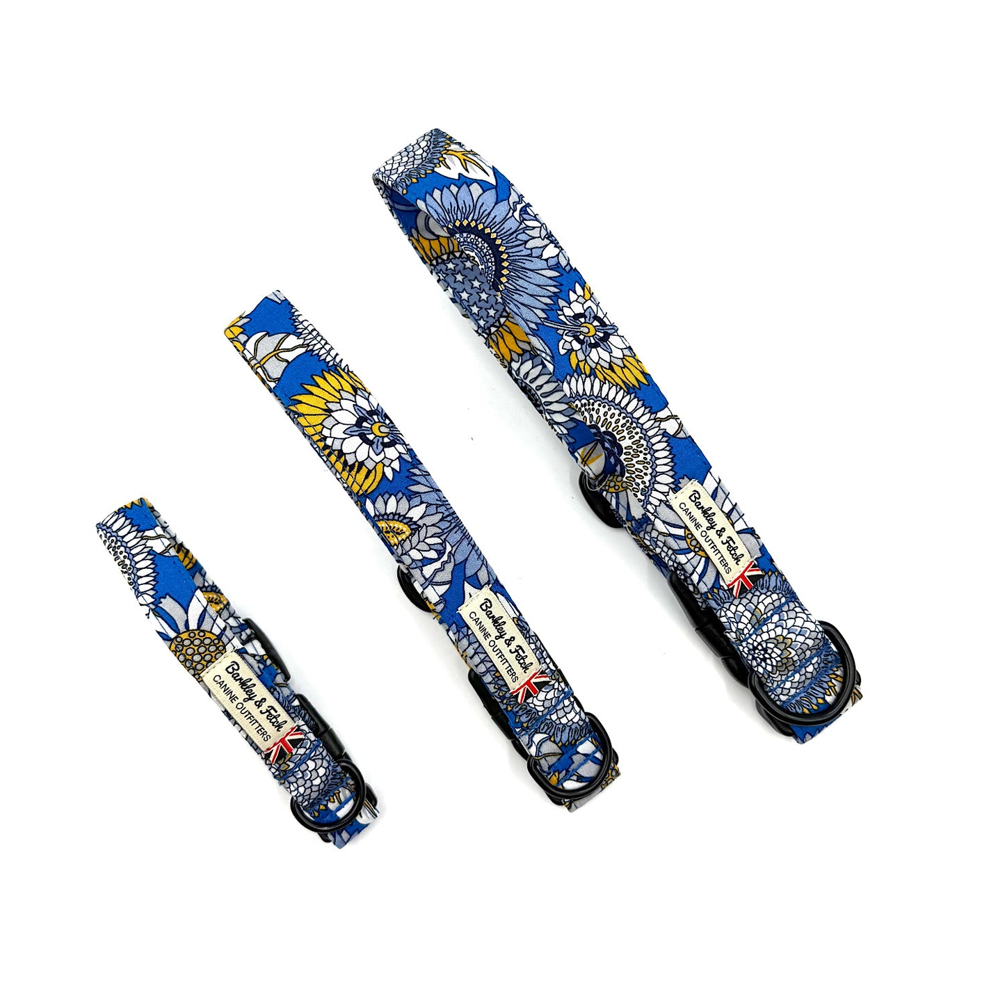 Set of three floral-patterned dog collars on a white background