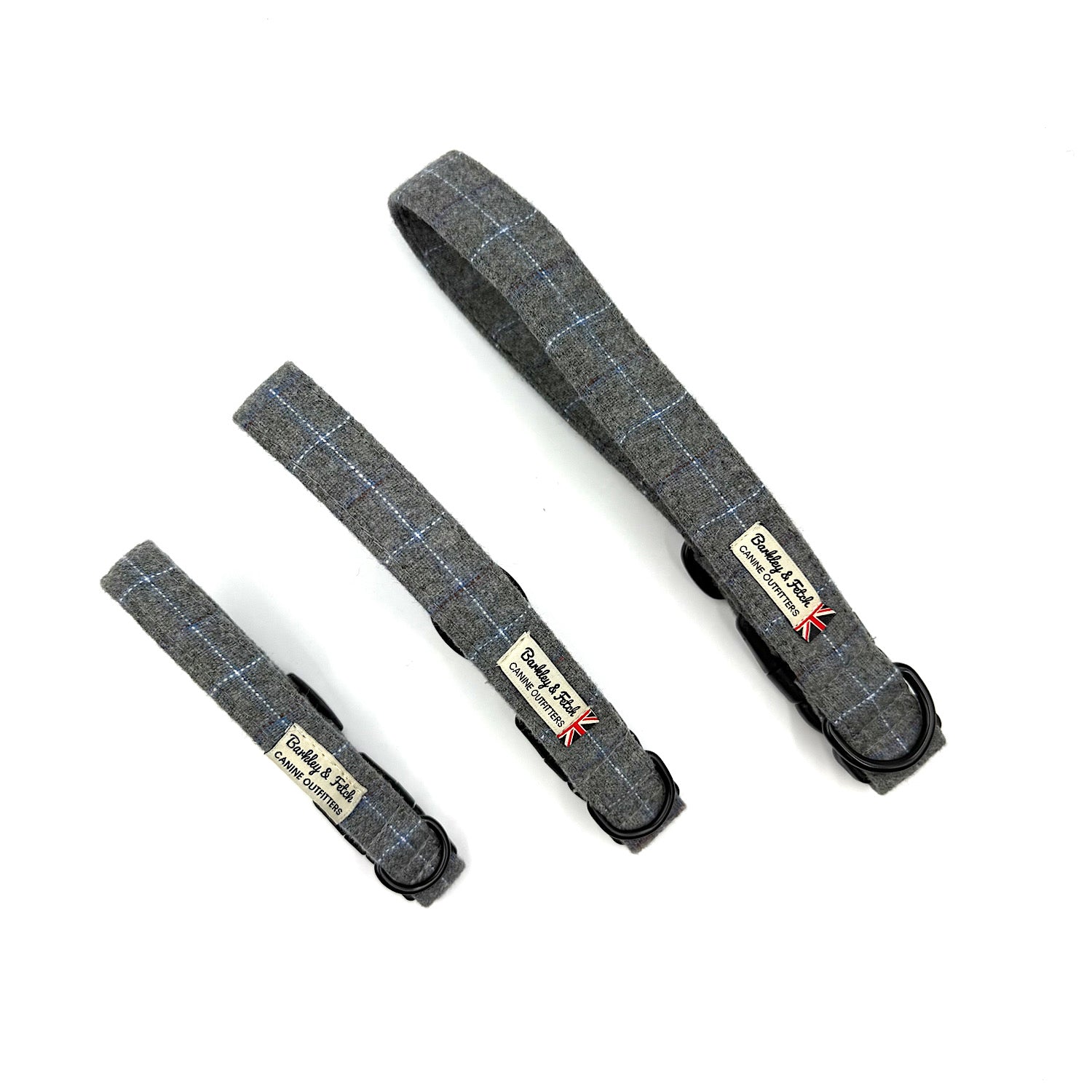 Three gray plaid dog collars with visible branding on a white background