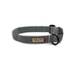 Houndstooth patterned dog collar with brand label on a white background