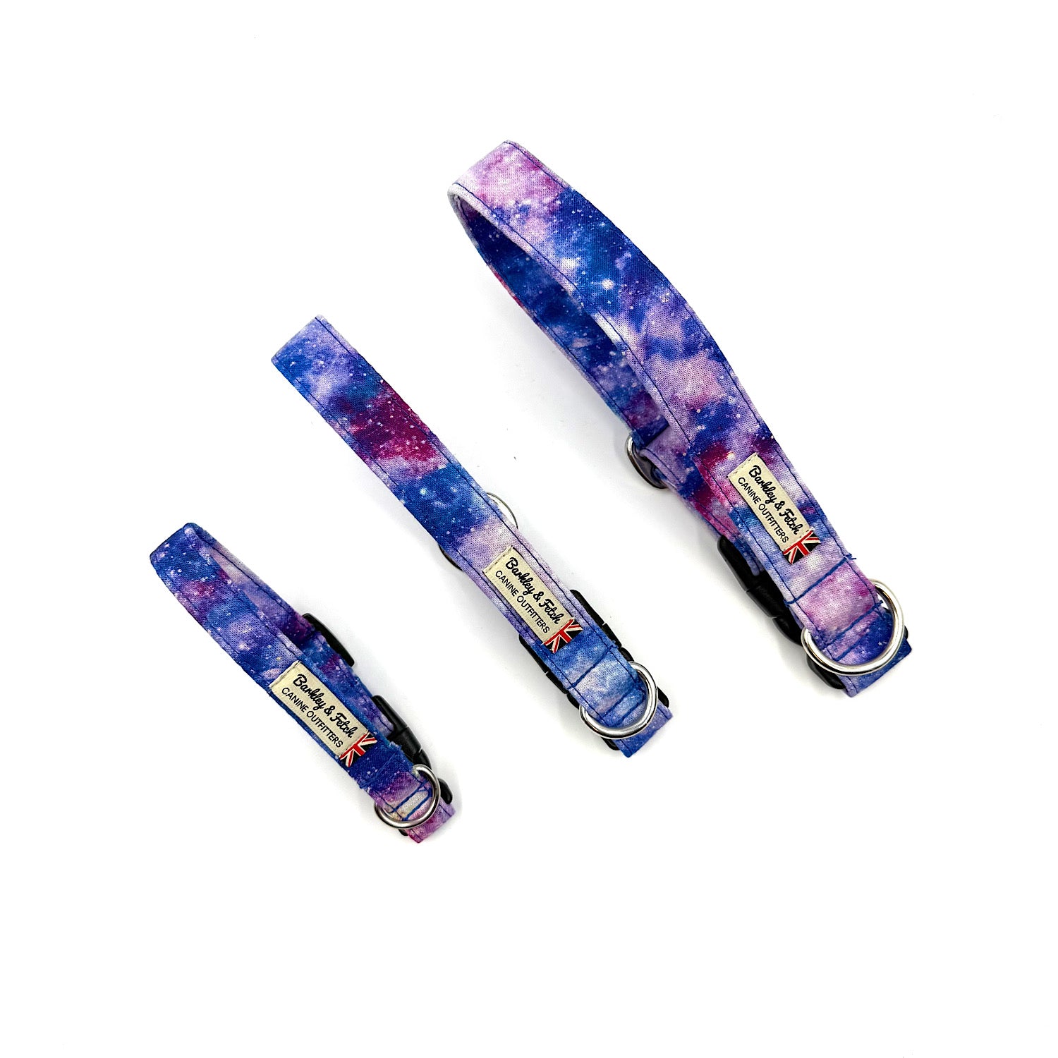 Three galaxy-themed dog collars with a visible brand label on a white background