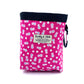 Pink floral-patterned pouch with a visible brand label on a white background