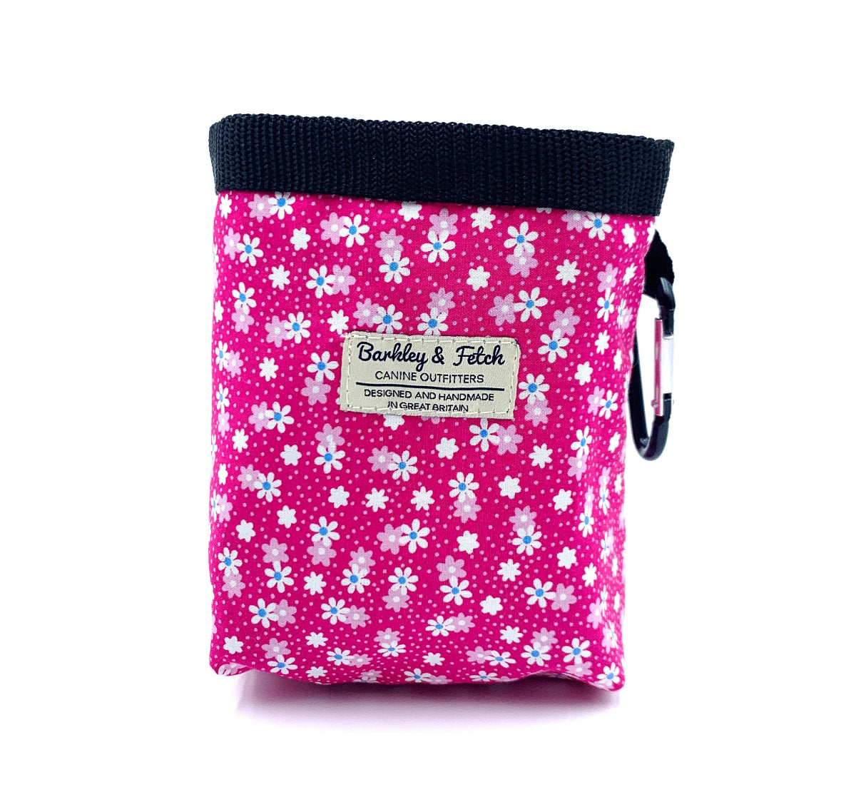 Pink floral-patterned pouch with a visible brand label on a white background