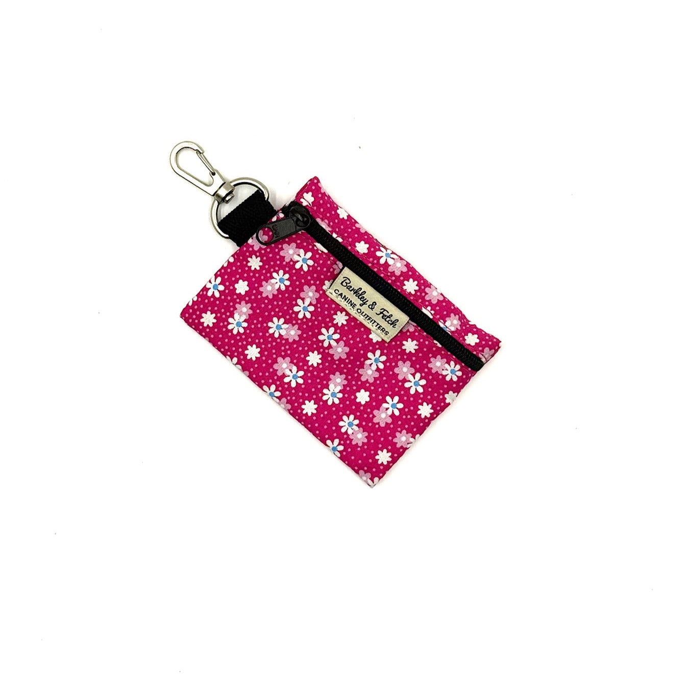Pink keychain pouch with white floral pattern on a white background