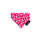 Pink floral patterned bandana with a black tag on a white background handmade by Barkley And Fetch