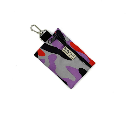 Multicolored camouflage keychain pouch with a visible Barkley and Fetch brand label on a white background