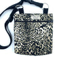 Leopard print bag with a black strap on a white background