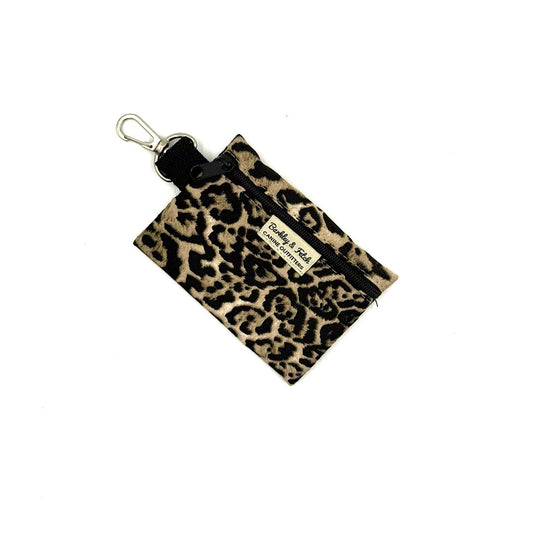 Leopard print pouch with keychain on a white background