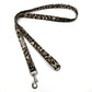 Leopard print dog leash on a white background