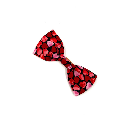 Heart-patterned bow tie on a white background