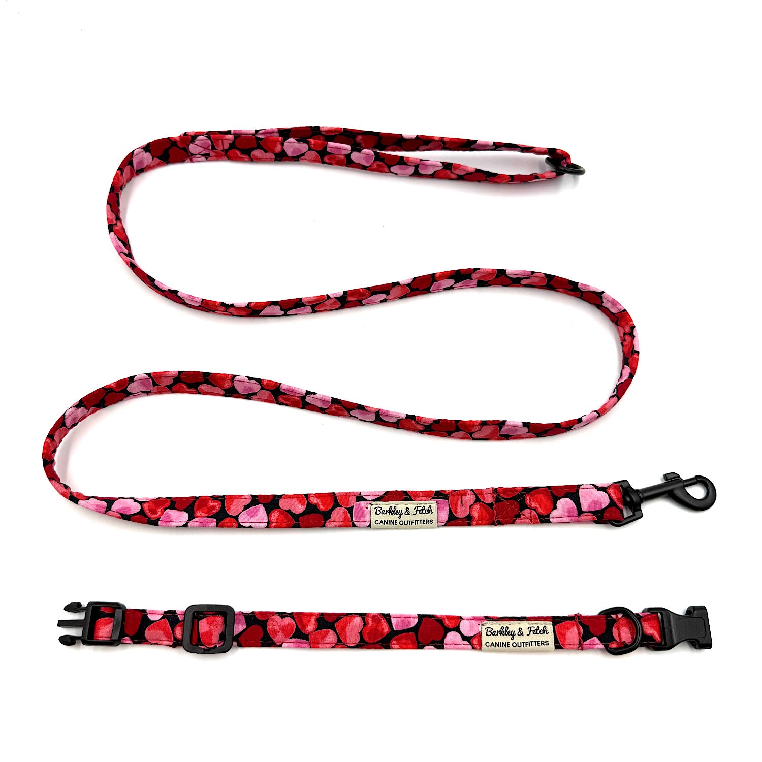 Heart-patterned dog leash and collar set on a white background