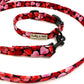 Dog collar and leash set with heart pattern on a white background