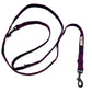 Purple dog leash with black clips on a white background