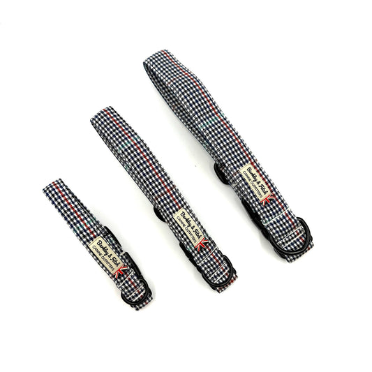 Set of three black and white checkered straps on a white background