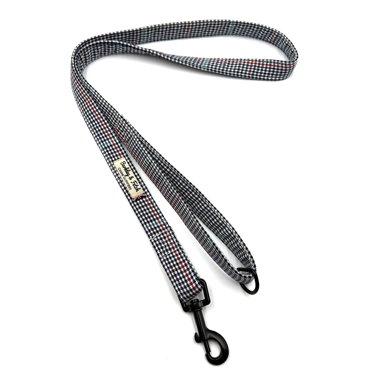 Checkered dog leash with a clip on a white background