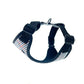 Navy blue dog harness with plaid pattern on a white background