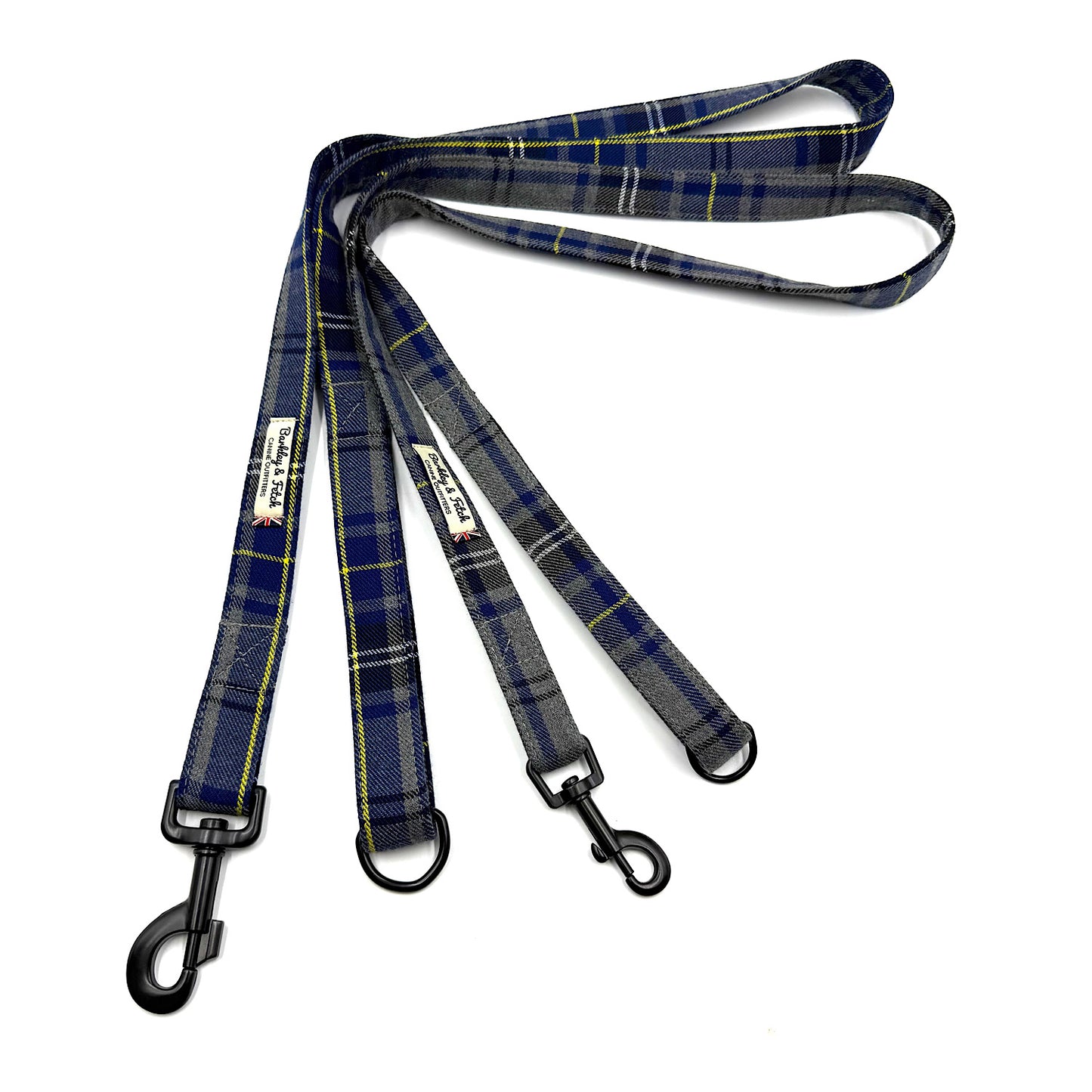 Plaid dog leash with black metal clips on a white background
