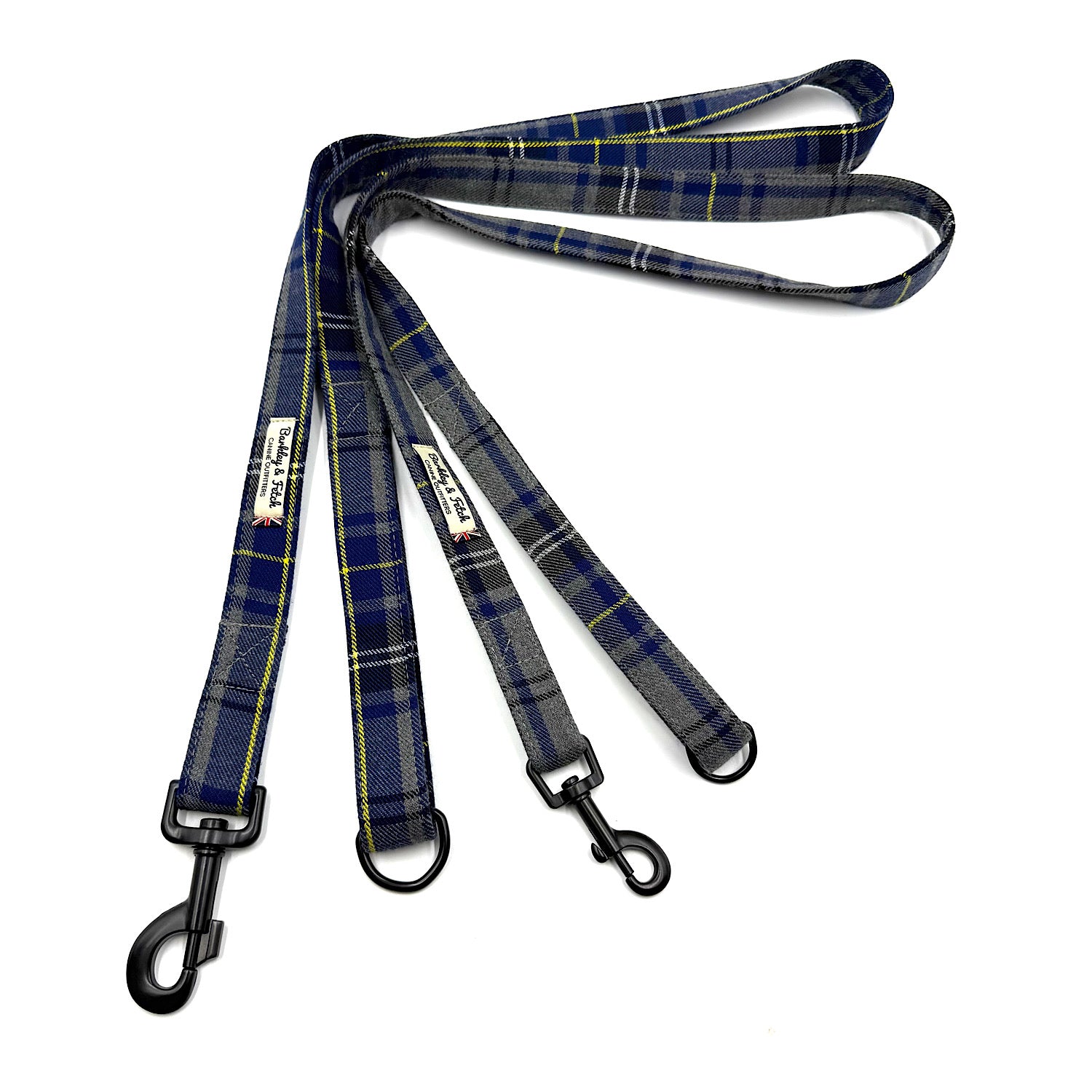 Plaid dog leash with black metal clips on a white background