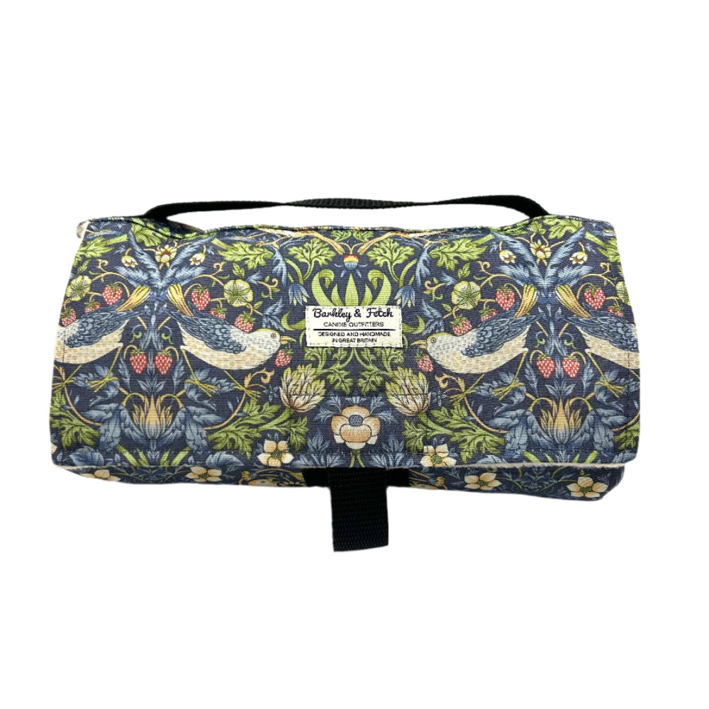 Patterned fabric roll with decorative design on a white background