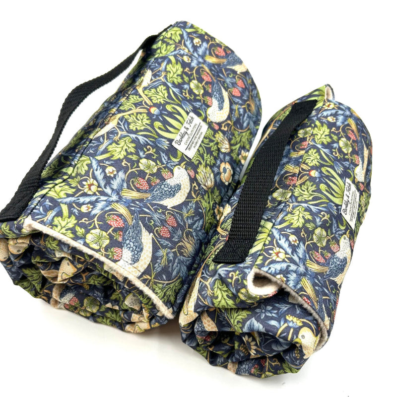Roll-up fabric mat with floral pattern on a white background