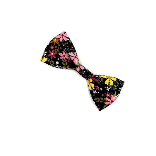 Floral-patterned bow tie on a white background
