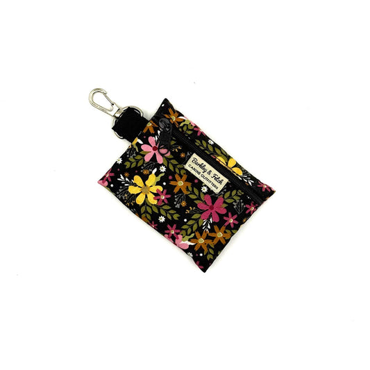 Floral patterned pouch with a keychain on a white background
