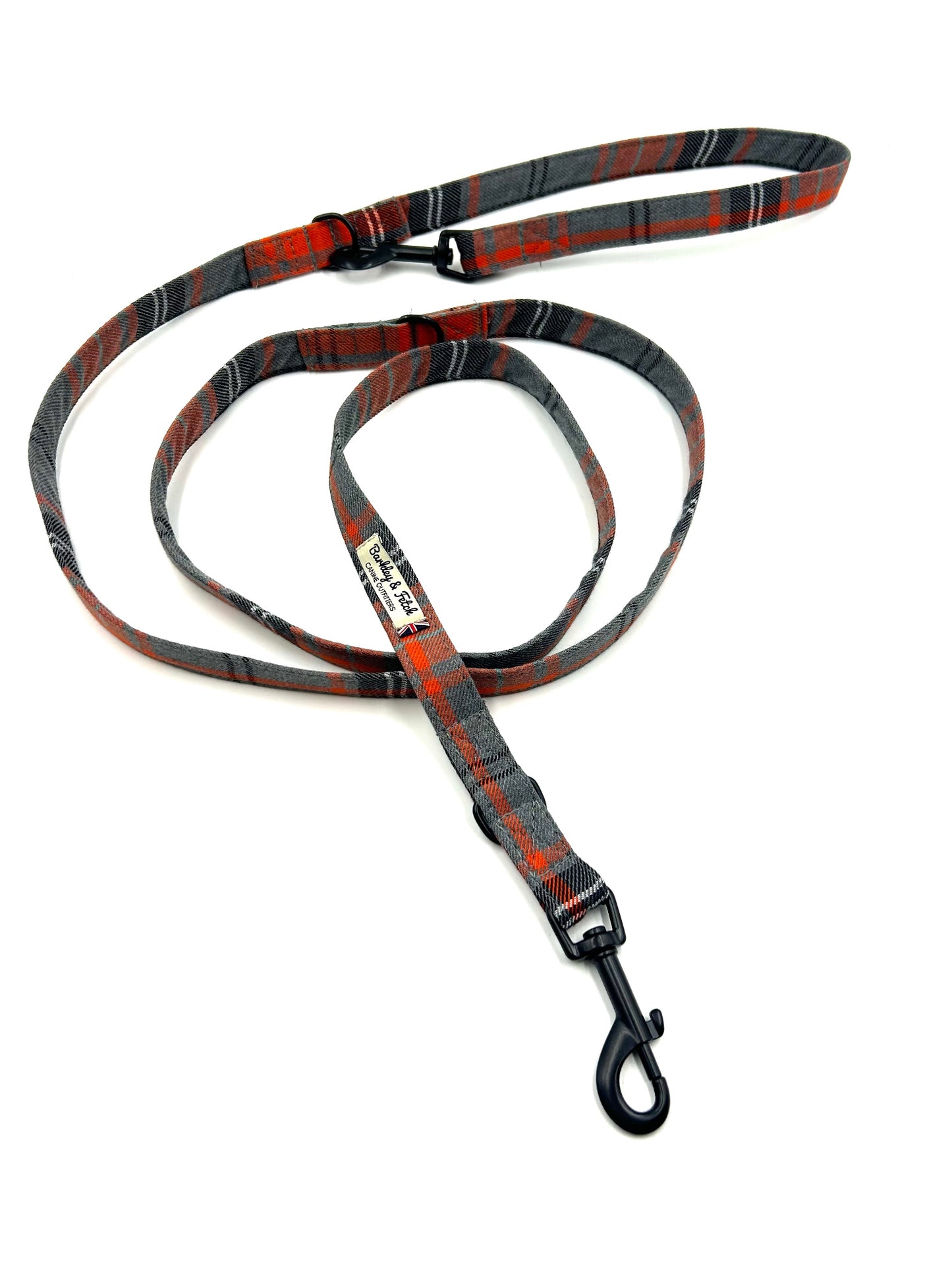 Dog leash with red and gray pattern on a white background